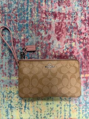 Coach Tan Signature Wristlet with Pink Strap